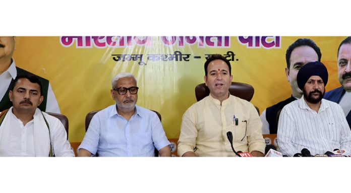 LoP Sunil Sharma accompanied by senior BJP leaders during a press conference at party headquarters, Trikuta Nagar, Jammu. — Excelsior/Rakesh