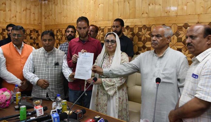 Chairperson J&K Waqf Board, Dr Darakhshan Andrabi and J&K BJP leaders handing over an appointment letter to brother of Adil Hussain Shah who attained martyrdom while fighting terrorists in Pahalgam recently. -Excelsior/Shakeel