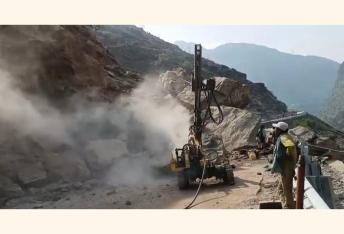 A JCB engaged in road clearance operation near Kishtwar. -Excelsior/Tilak Raj