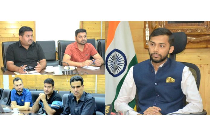 Director Information Nitish Rajora chairing a meeting at Srinagar on Tuesday. Director Information Nitish Rajora chairing a meeting at Srinagar on Tuesday.