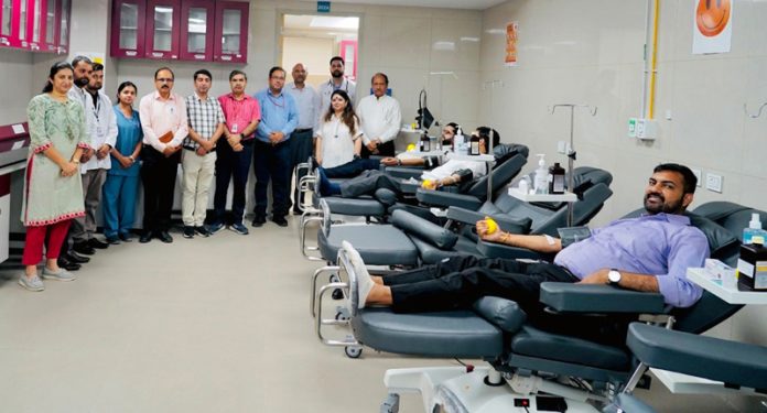 Faculty and staff of AIIMS Jammu during a blood donation drive in the Institution.