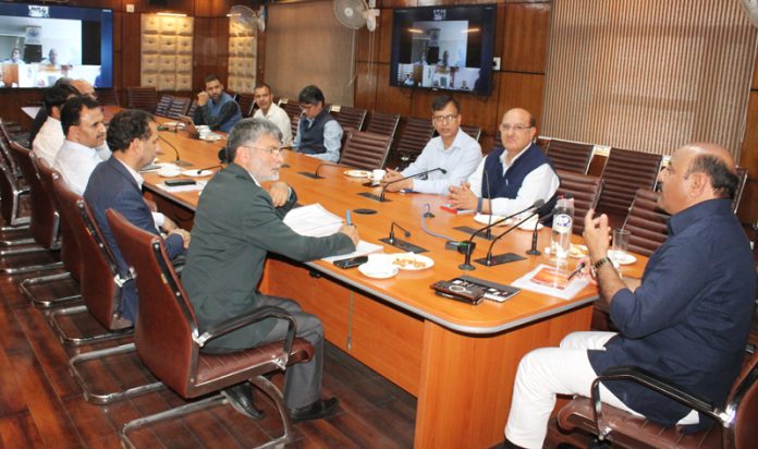 DyCM chairing a meeting at Srinagar on Tuesday. DyCM chairing a meeting at Srinagar on Tuesday.