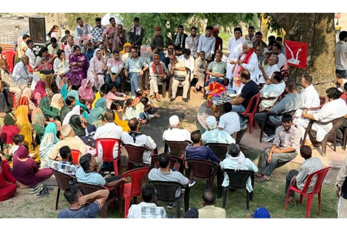 Senior NC leader, Ajay Kumar Sadhotra, addressing a public meeting in village Dhar Mahanpur of Basohli in Kathua district.