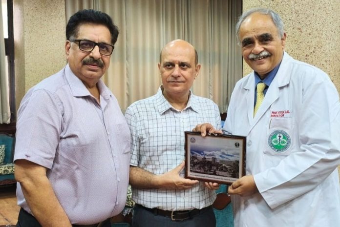 Principal GMC Jammu Dr Ashutosh Gupta being awarded by Director PGIMER Chandigarh Dr Vivek Lal.