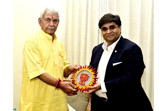 Chairman Indian Chamber of Commerce, Jammu, Rahul Sahai presenting an idol of Hanuman Ji to LG, Manoj Sinha.