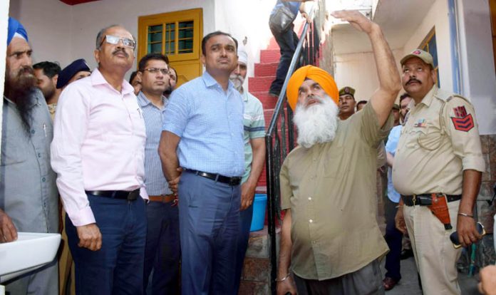 Div Com assessing damage due to Pak shelling in Poonch on Saturday.