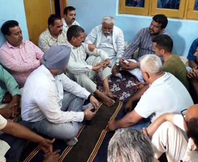 Senior NC leader Ajay Kumar Sadhotra condoling the family of martyr Sunil Kumar Bhagat at their house in village Trewa, RS Pura (Jammu).
