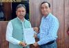 MLA Kathua Dr Bharat Bhushan presenting a memorandum to MD JKRTC Rakesh Kumar Sarangal.