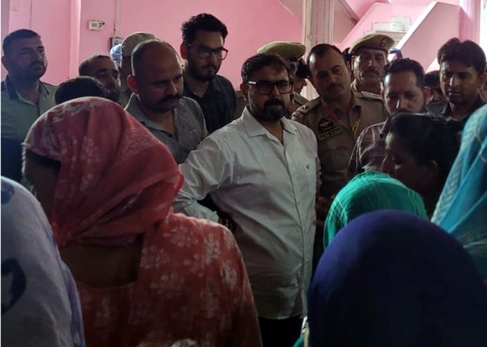 Minister Satish Sharma during visit to the shelter camp on Friday.