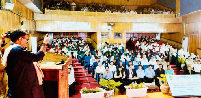 Minister Javed Rana addressing a gathering at Srinagar on Thursday.