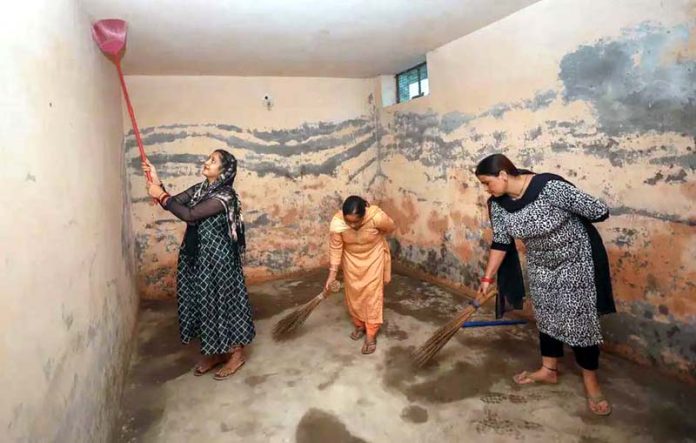 Villagers cleaning a bunker after firing by the Pakistan Rangers at the Arnia area of Jammu & Kashmir. Villagers cleaning a bunker after firing by the Pakistan Rangers at the Arnia area of Jammu & Kashmir.
