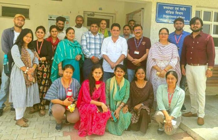 Students posing for a group photograph during a function held at CUJ.