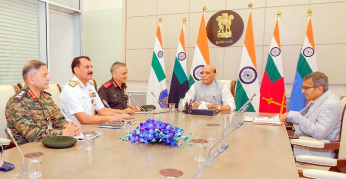 Defence Minister Rajnath Singh chairing a meeting in New Delhi on Tuesday. (UNI) Defence Minister Rajnath Singh chairing a meeting in New Delhi on Tuesday. (UNI)