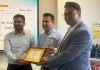 Kush Sambyal, Service Manager, Diamond Honda receiving an award on Tuesday.
