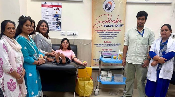 A donor donating blood during a camp organised by Subhadra Society in Jammu on Monday
