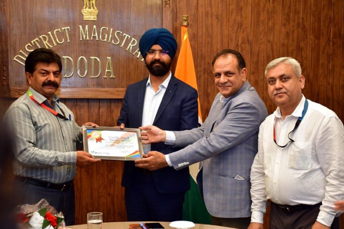 DC Doda presenting certificate to J&K Bank officer on Tuesday. DC Doda presenting certificate to J&K Bank officer on Tuesday.
