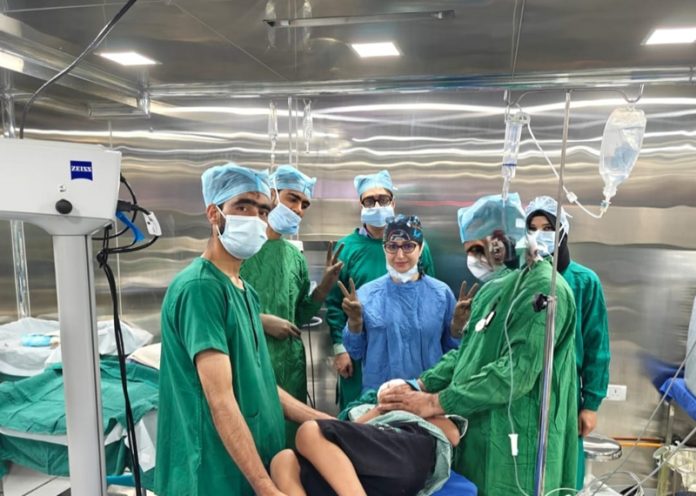 Doctors performing surgery at Dr Agarwal's Eye Hospital in Srinagar.