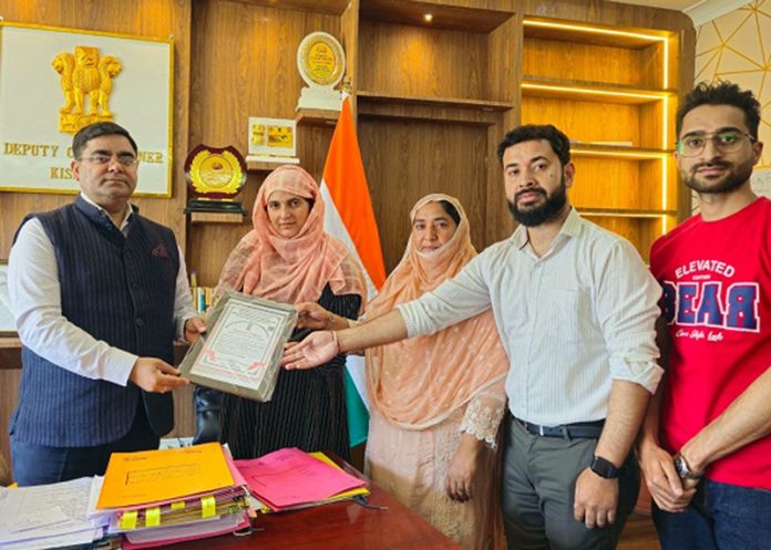 DC Kishtwar giving Registration Certificate. DC Kishtwar giving Registration Certificate.