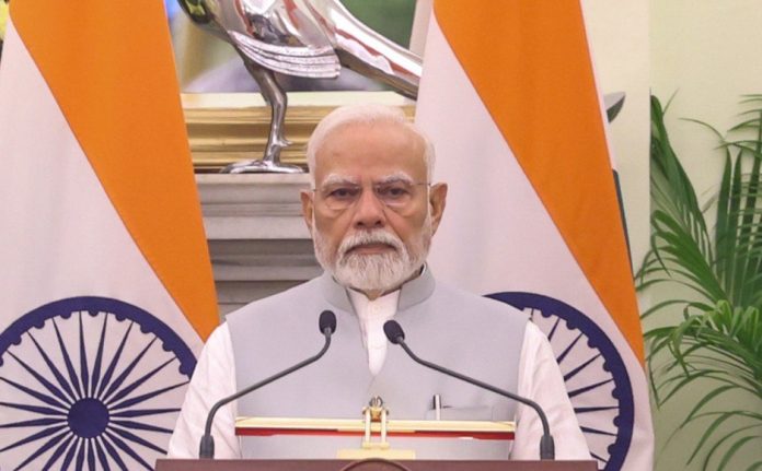 Prime Minister Narendra Modi briefing newsmen after a meeting at Hyderabad House in New Delhi on Saturday. (UNI)