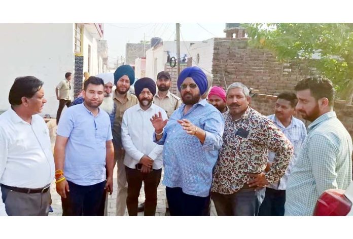 Manjit Singh and Taranjit Singh Tony during visit to border villages of Suchetgarh.