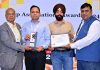 Dr Gopal Parthasarthi Sharma and Gurpreet Singh receiving an award on Sunday.