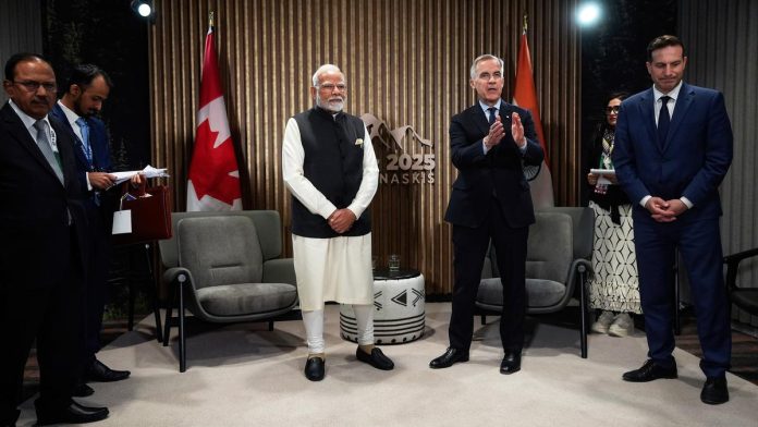Canada’s Prime Minister Mark Carney (centre right) speaks as India’s Prime Minister Narendra Modi (centre left) and Mr. Carney’s Chief of Staff Marco Mendicino (right) listen before a meeting at the G7 Summit in Kananaskis, Alberta