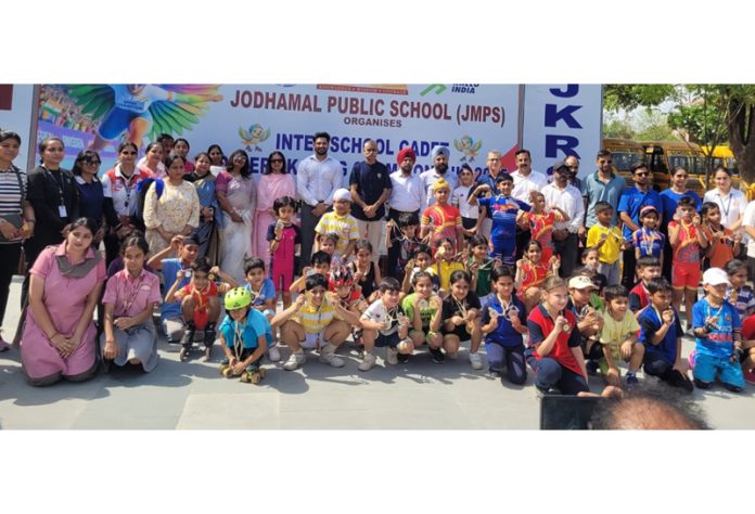 Winners posing along with medals during a programme.