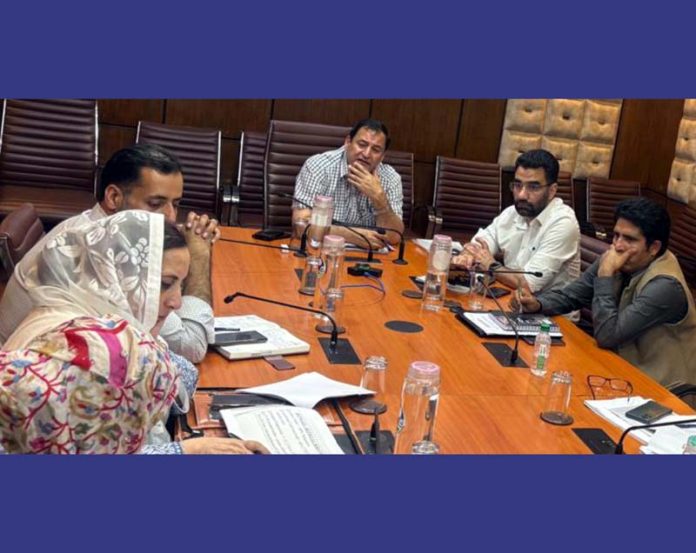 Minister Javid Dar chairing a meeting on Wednesday.