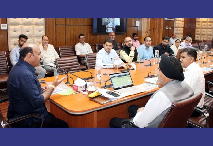 DyCM chairing a meeting at Srinagar on Wednesday.
