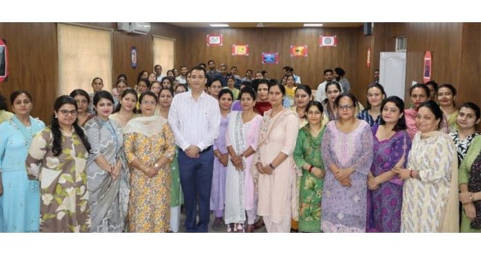 Rajiv Khajuria posing along with teaching faculty of APS Damana.