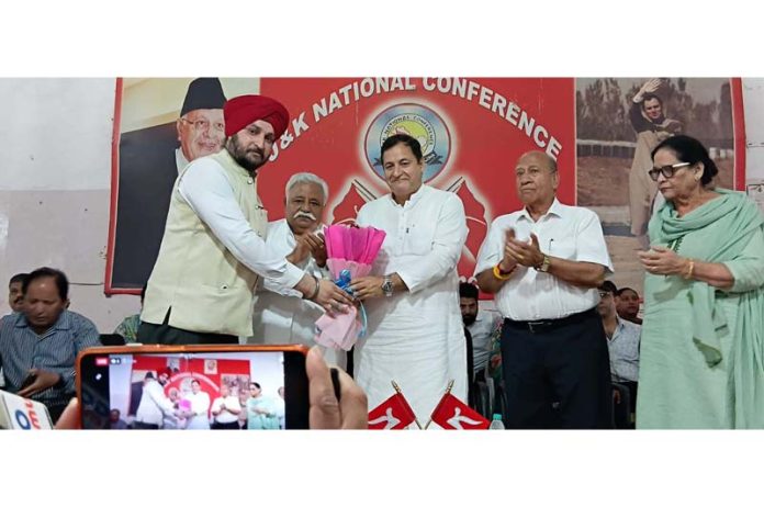 Minister Javid Dar being felicitated by YNC president TP Singh Aman during youth convention in Jammu.