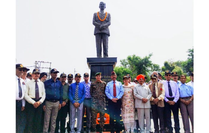 Dignitaries from JKESL and Army near Brig Rajinder Singh’s statue after paying floral tribute to the brave officer in Jammu on Saturday.