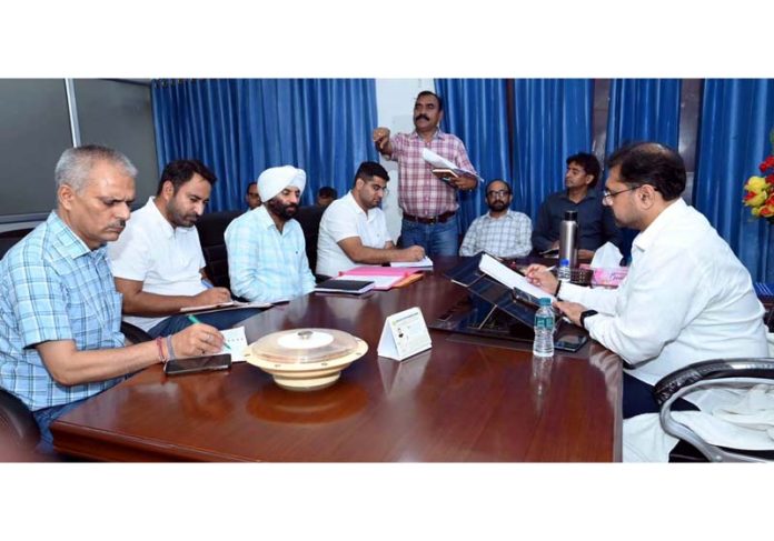 Minister Satish Sharma chairing a meeting on Saturday.