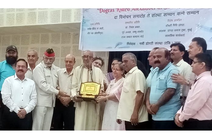 Dignitaries during a book release function in Jammu on Monday.