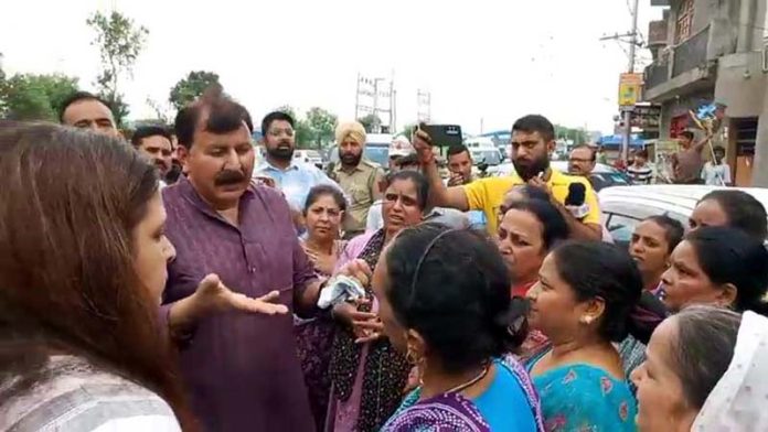 MLA Jammu West Arvind Gupta pacifying locals protesting at Bhagwati Nagar, Jammu. MLA Jammu West Arvind Gupta pacifying locals protesting at Bhagwati Nagar, Jammu.
