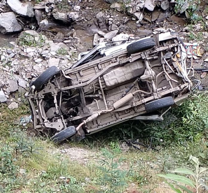Mingled remains of car that fell in gorge in Doda on Sunday.