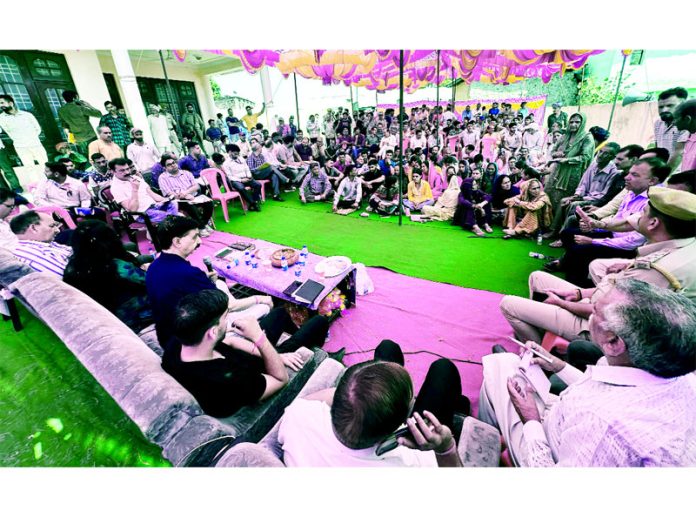 MLA Pawan Gupta listening issues of local residents during public darbar on Monday.