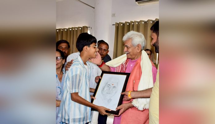 LG Manoj Sinha being presented painting at Sant Kabir function in Bishnah on Sunday.