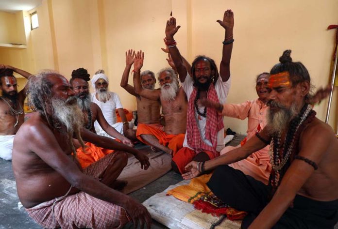 Sadhus at Ram Mandir in Jammu singing bhajans waiting for start of Shri Amarnath Yatra. -Excelsior/Rakesh Sadhus at Ram Mandir in Jammu singing bhajans waiting for start of Shri Amarnath Yatra. -Excelsior/Rakesh