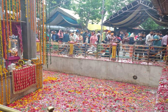 Devotees at Kheer Bhawani Mela at Tulmulla in Ganderbal on Tuesday. -Excelsior/Firdous
