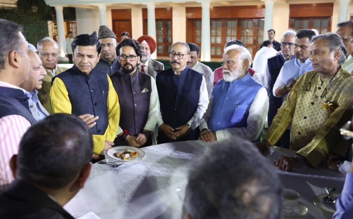 PM Narendra Modi meets the members of various delegations who represented India in various countries at his residence in New Delhi on Tuesday.