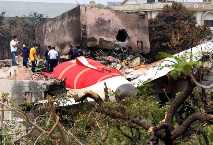 Members of the Investigation Agency searching at the crash site of Air India plane in Ahmedabad on Saturday. (UNI)