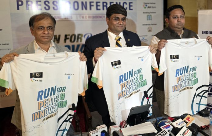 Indian Chamber of Commerce members and others unveiling jersey. —Excelsior/Rakesh