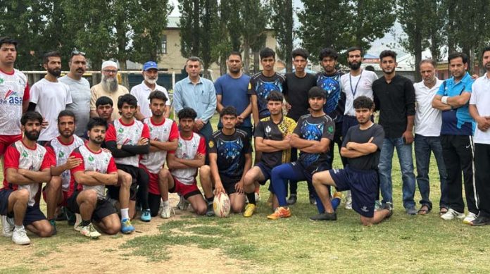Rugby players posing for a group photograph.