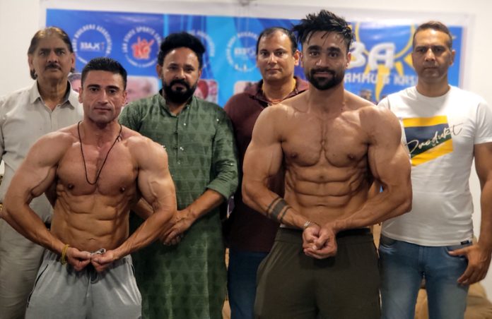 J&K Bodybuilders posing along with dignitaries. J&K Bodybuilders posing along with dignitaries.
