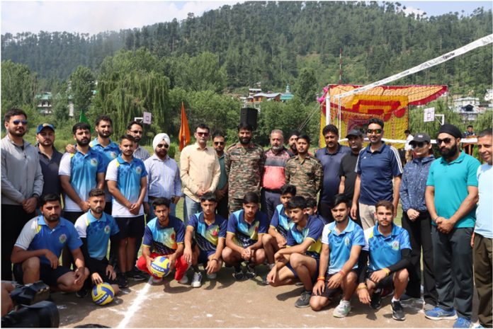 Dignitaries posing along with players during a sports event at Bhaderwah campus.