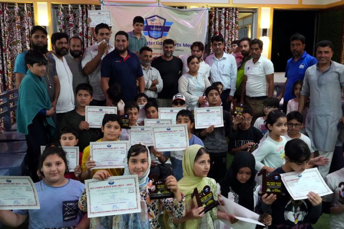 Players posing along with certificates during a programme.