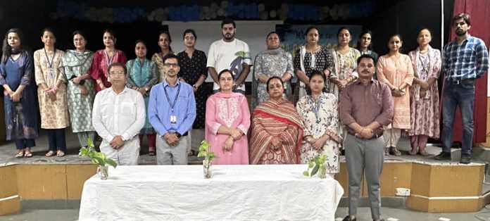 A dignitary lighting lamp during programme.