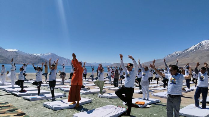 Participants performing Yoga during a mega camp at Leh.