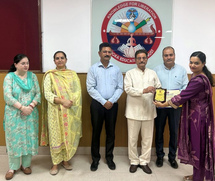 College Management presenting memento to a participant.